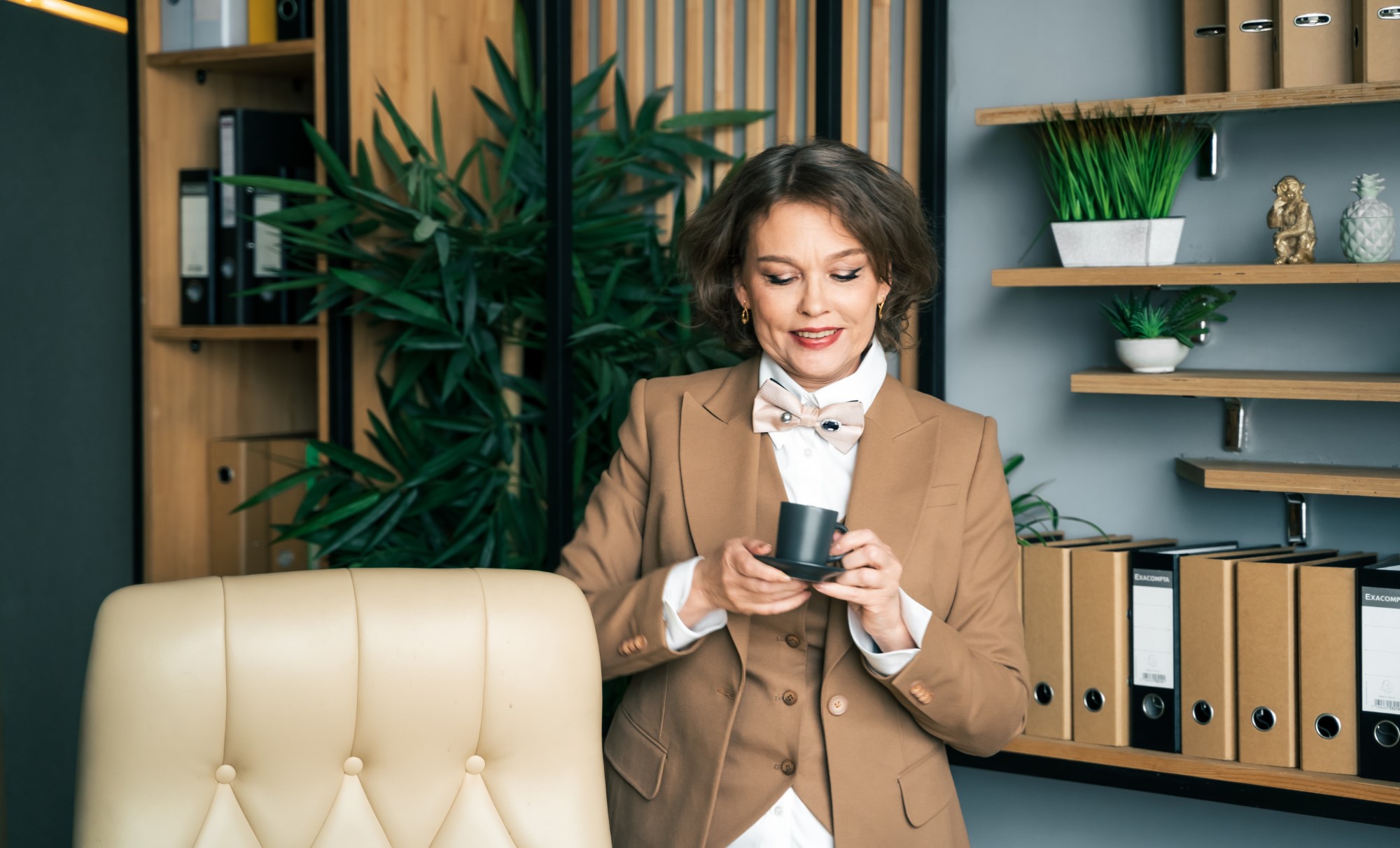 Confident stylish mature middle aged elderly woman in office. General manager,ceo. Old senior businesswoman,60s lady in suit, executive business leader. Entrepreneur career.Accountant bank workplace